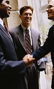 Smiling Businessmen Shaking Hands